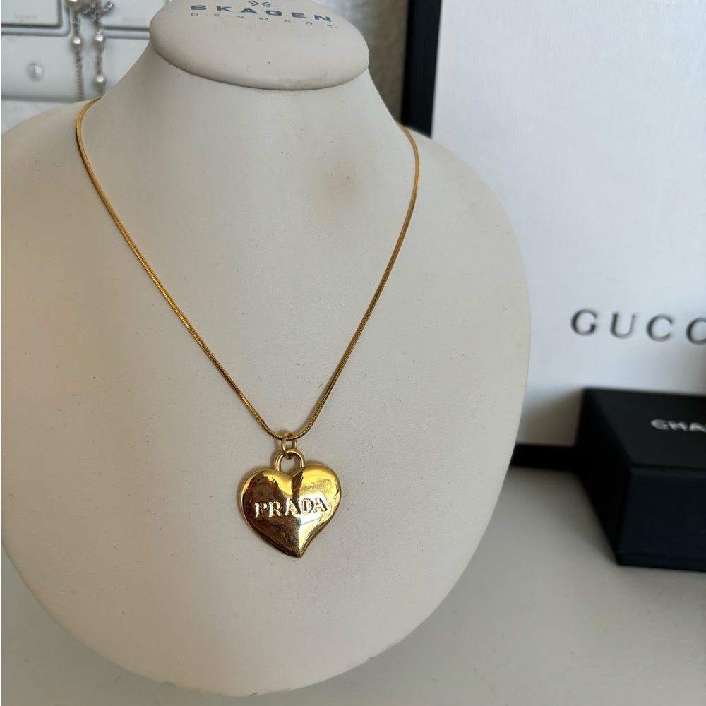 Gold heart prada necklace